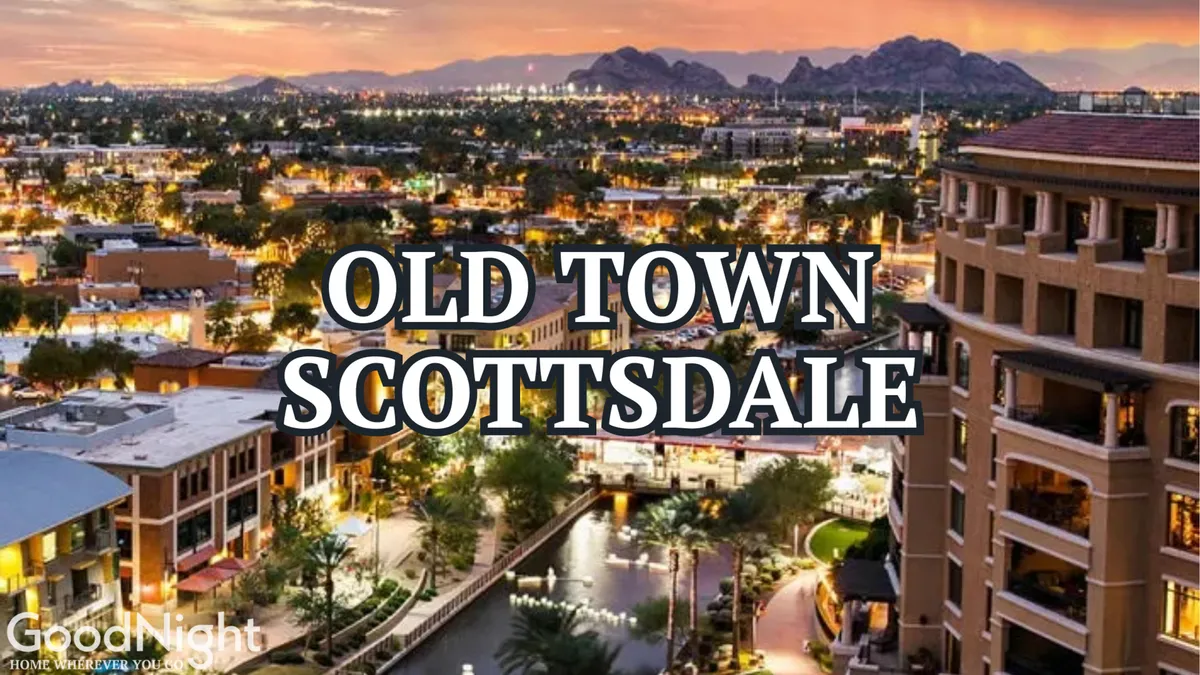 A stunning view of the city skyline at sunset, backdropped by mountains, a waterway, and palm trees. The lively ambiance suggests a vibrant nightlife and cultural energy, echoing the excitement of Old Town Scottsdale.